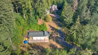 Experience the ultimate in privacy and space with this stunning 20-acre property, beautifully captured from above.