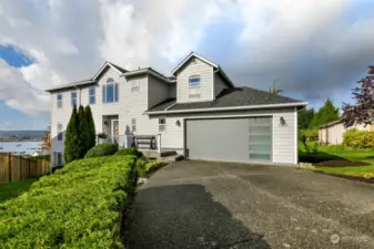 Freshly painted exterior & 1 year old roof w/ level driveway and access to front door