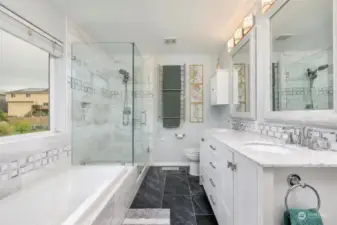 Large shower, soaking tub, tile floors, 2 sink vanity & towel warmer comfort too!