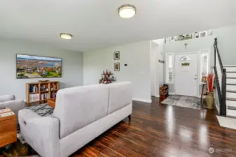 Living room off the entry w/ laminate wood floors