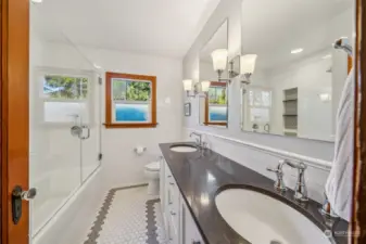 The home features timelessly remodeled bathrooms, beautifully updated with elegant finishes and fixtures that perfectly blend modern luxury with classic charm.