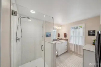 Updated 3/4 bathroom upstairs with full subway tile surround shower, tile floors, undermount sink + additional vanity area for storage.