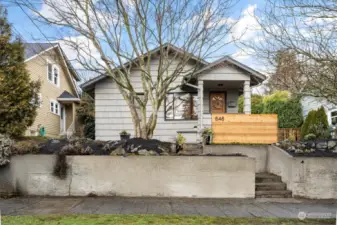 Charming House sits above the street offering privacy. Home faces south and gets great light. Front maple tree offers shade and color in the summer.