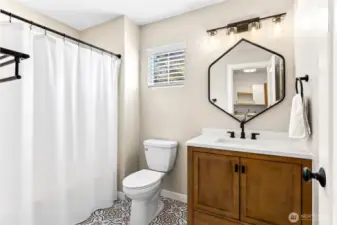 Remodeled hall bath. Come check out the dynamic flooring!