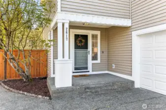 Welcoming front porch with a screen door.