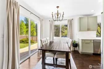 Dining room adjacent to kitchen. Light and bright all day long!