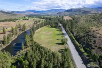 Looking north across your 5 acre Methow riverside paradise