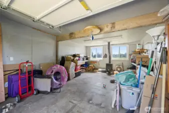Additional Parking or shop area in this two bay detached garage. All set up with power and Stove.
