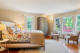 The primary bedroom is spacious with a beautiful bay window, walk-in closet and updated attached bath.