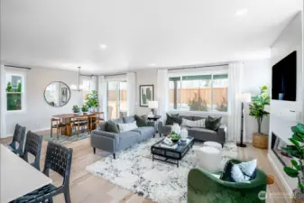 Open layout great room, dining room and kitchen. Photos not of this home