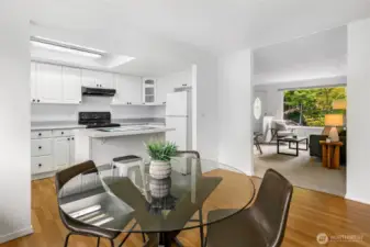 Dining room with kitchen and view into living room