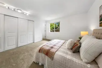 Primary bedroom with double closet and attached full bath