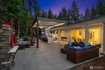 And now for the exterior! Enjoy the luxury of a show-stopping outdoor culinary space featuring a pizza oven and high-end appliances