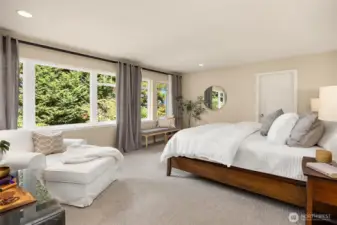 The primary suite overlooks the back yard and has two walk-in closets.