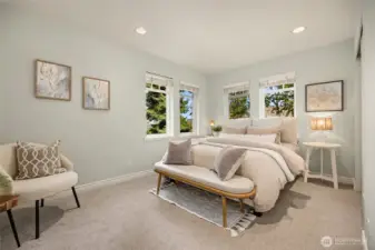 The third bedroom on the upper level has peek-a-boo views of the Sound.