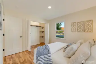 Primary closet with added shelving for media components.