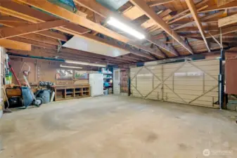 Inside of the two car garage with work benches.
