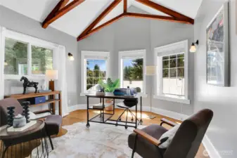 Vaulted ceilings in the home office add architectural interest and style, creating an elevated and inspiring workspace