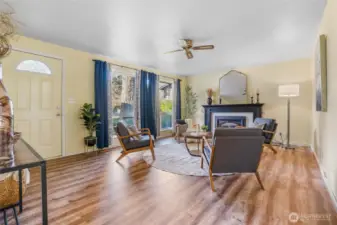 Welcome in the front door to your cozy living room with gas fireplace.