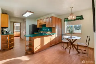 ADU has a full kitchen.  The door to the right just before the kitchen goes down to the garage and has a separate entrance.  You can also access the ADU from the mainhouse.