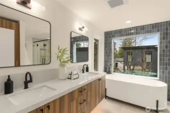 Retreat to the primary spa-like bath with heated tile flooring.