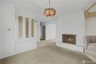 Fireplace in the dining room that connects to kitchen and living