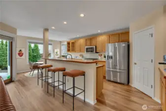 Kitchen with Counter Seating and Breakfast Nook. Virtually Staged.