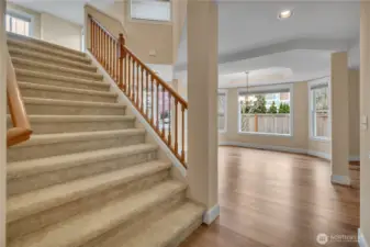 Extra wide staircase opens to the upper floor