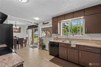 Spacious kitchen with slider to patio/yard