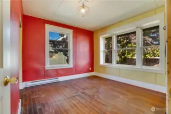 From the front door take a right into the main floor bedroom with fir floors.