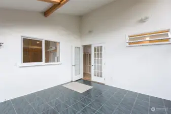 Sunroom with window to kitchen