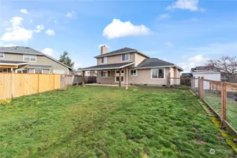 Fully fenced with garden pad and backyard storage