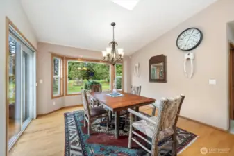 Dining area adjacent to the kitchen and overlooks the beautiful patio and sweeping acreage