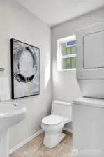 Powder room & laundry on main.