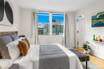 Two bedrooms with oversized windows and walk in closets are ideally positioned on opposite corners of the home for privacy —the owner’s suite with en suite bath and a second bedroom plus additional full bath.