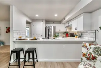 Room for so much bar seating. Notice the nice pantry the kitchen offers.