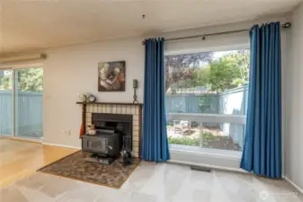 Large windows and a cozy wood stove