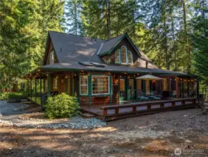 This home is nestled into the trees and just a short walk to the lake!