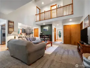 The hallway to the 2 upstairs bedrooms and full bathroom overlooks the living room.