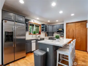 The kitchen features a large pantry as well as ample cupboard space for storage.