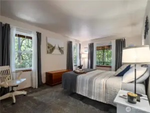 The large primary suite is located just off the living room on the main floor.