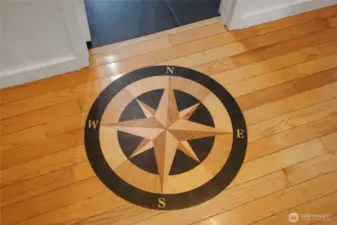 Maple floors were added by sellers and boast this gorgeous compass inlay.