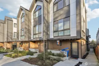 Sidewalk shown to the right of the front building