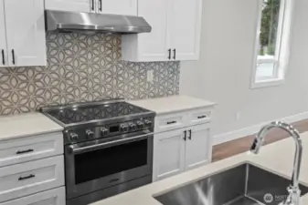 Kitchen with farm sink and induction range