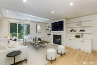 Family room with skylight built-ins and gas fireplace