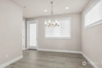 Dining room open to the patio with the huge covered Trex deck which spans the full width of the home.