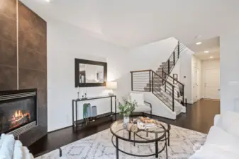 upgraded tile surround gas log fireplace.