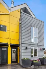 Immaculate end unit facing inner courtyard up a level from the street in a gated community.