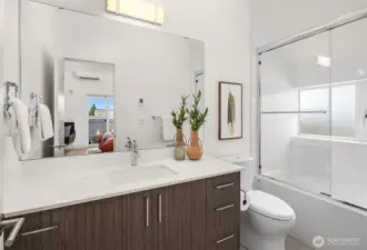 Second bathroom with tub.