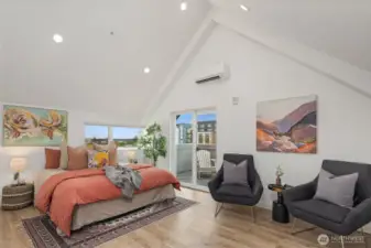 Light and airy - an incredibly spacious primary bedroom easily holds a King bed with room for seating.